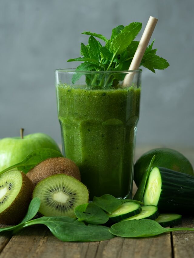 green liquid in clear drinking glass with straw